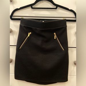 GUESS black mini skirt with gold zipper accents
